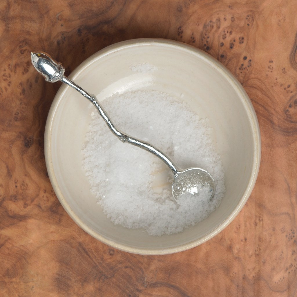 a tiny spice, salt or condiment spoon. Our pewter spoon has a small 10mm bowl leading up a fine twig textured handle to a small acorn. From little acorns gifts