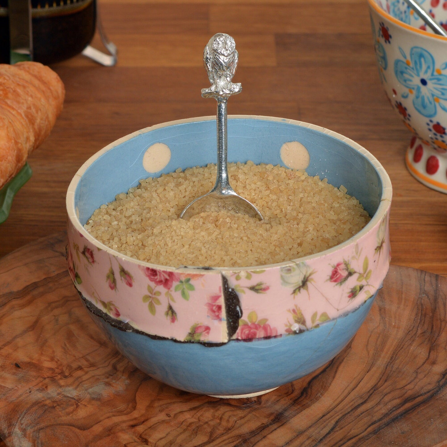 A small spoon pewter sugar spoon. A round bowled spoon on a straight handle leads to a perfectly sculpted owl. Practical & useful bird gifts for bird lovers. UK handmade