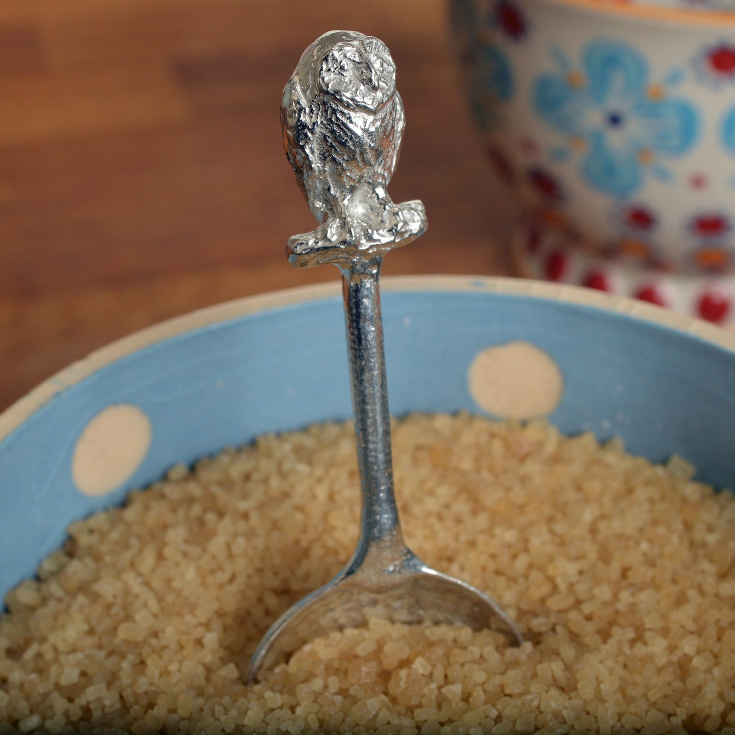 A small spoon pewter sugar spoon. A round bowled spoon on a straight handle leads to a perfectly sculpted owl. Practical & useful bird gifts for bird lovers. UK handmade