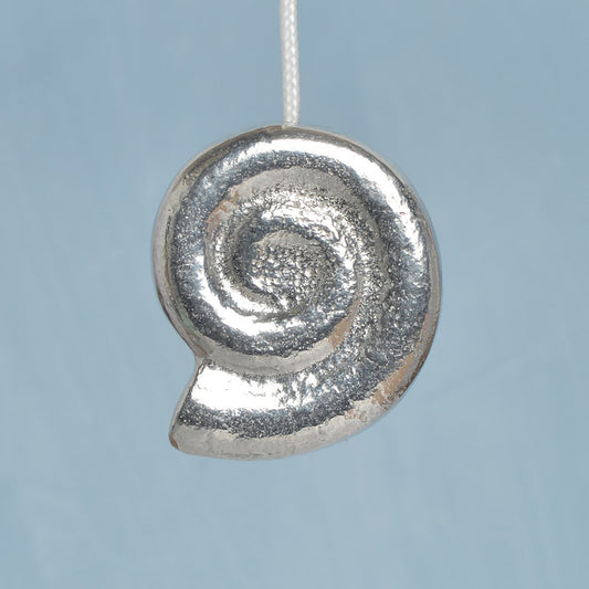 Whirley shell bathroom light pull or cord pull. A tactile and decorative pewter Whirley shell hangs at the bottom of the bathroom light switch cord. ideal little housewarming gifts.