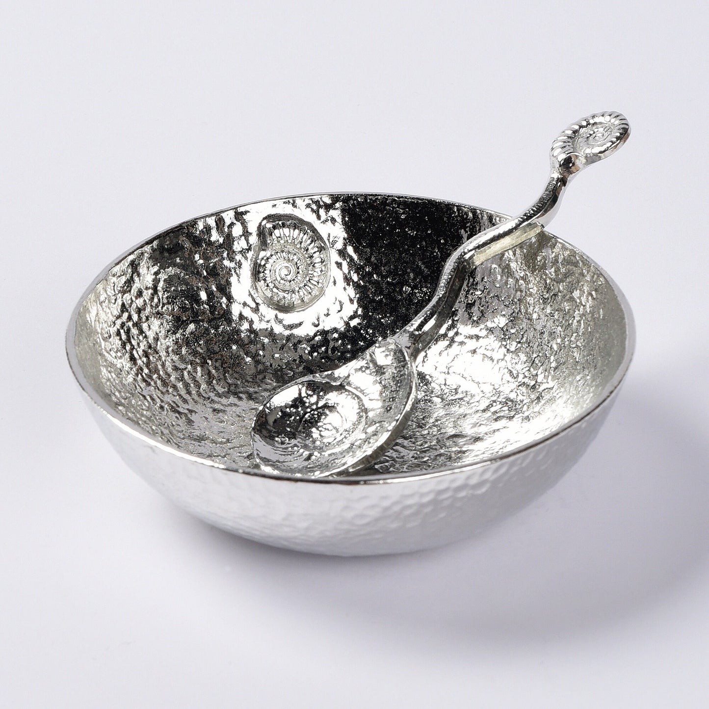 A 9cm diameter beautifully textured circular pewter bowl, with a striking, yet subtle ammonite fossil on the inside of the dish, comes with accompanying ammonite fossil spoon. Gifts For Fossil Lovers