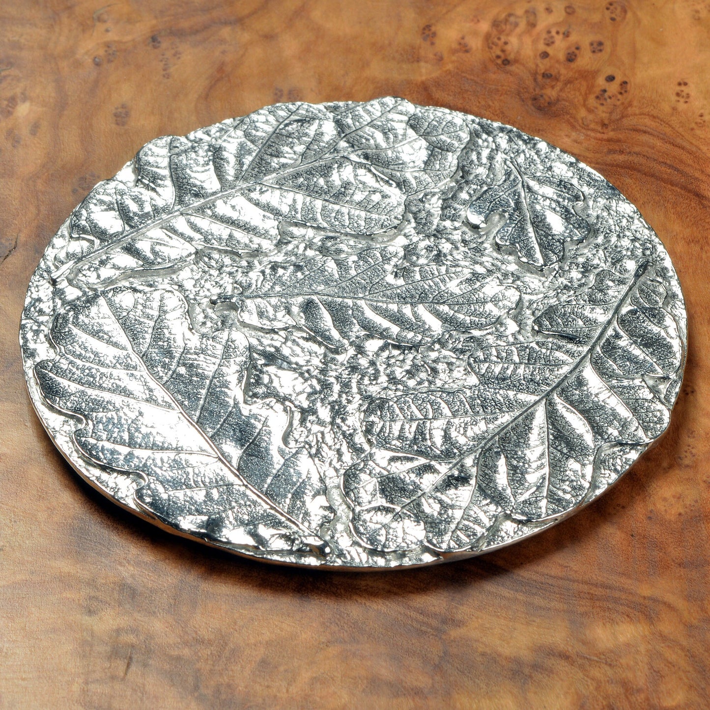 Oak leaf coaster, a circular composition of detailed cast oak leaves form an actractive round pewter drinks coaster. Practical and useful housewarming gifts, ideal gifts for nature lovers, UK handmade