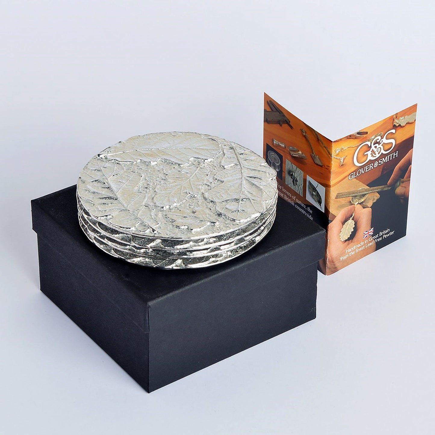 Oak leaf coaster set of 4. Each coaster is a circular composition of detailed cast oak leaves forming actractive round pewter drinks coasters. Practical and useful housewarming gifts, ideal gifts for nature lovers, UK handmade