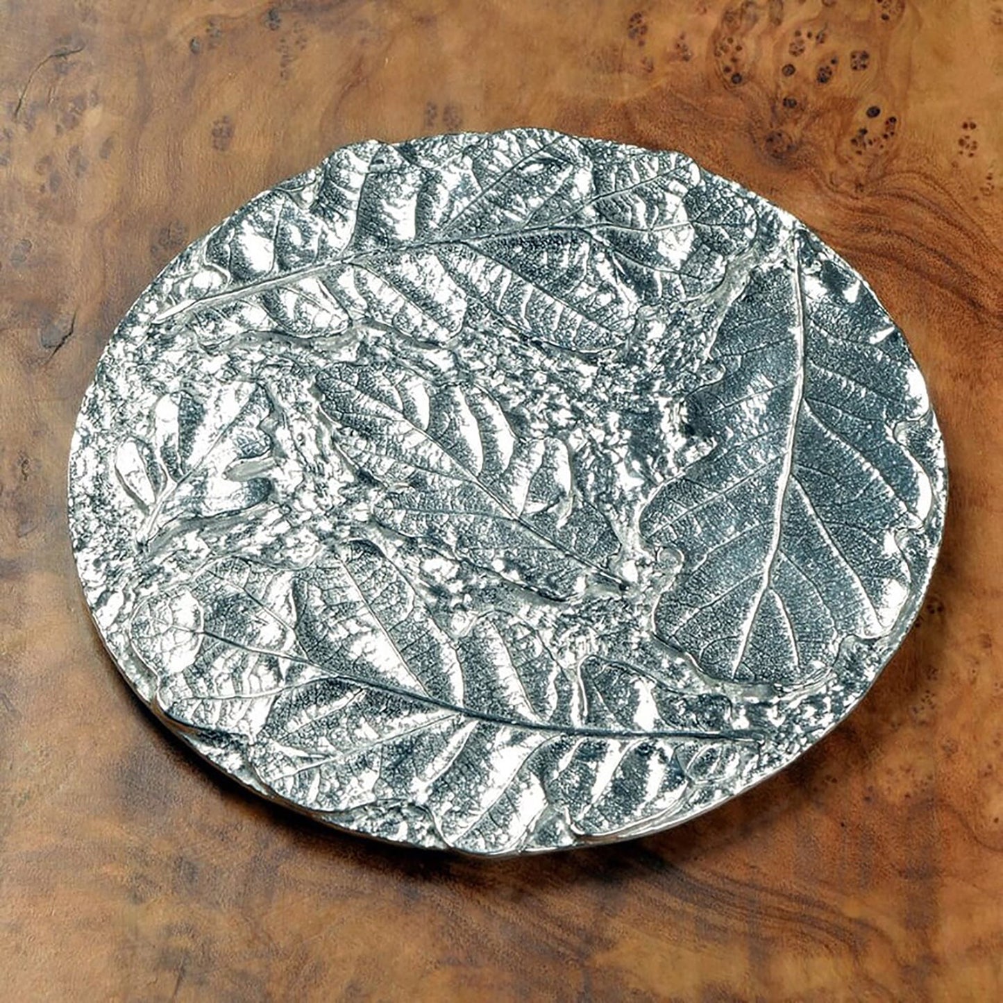 Oak leaf coaster set of 4. Each coaster is a circular composition of detailed cast oak leaves forming actractive round pewter drinks coasters. Practical and useful housewarming gifts, ideal gifts for nature lovers, UK handmade