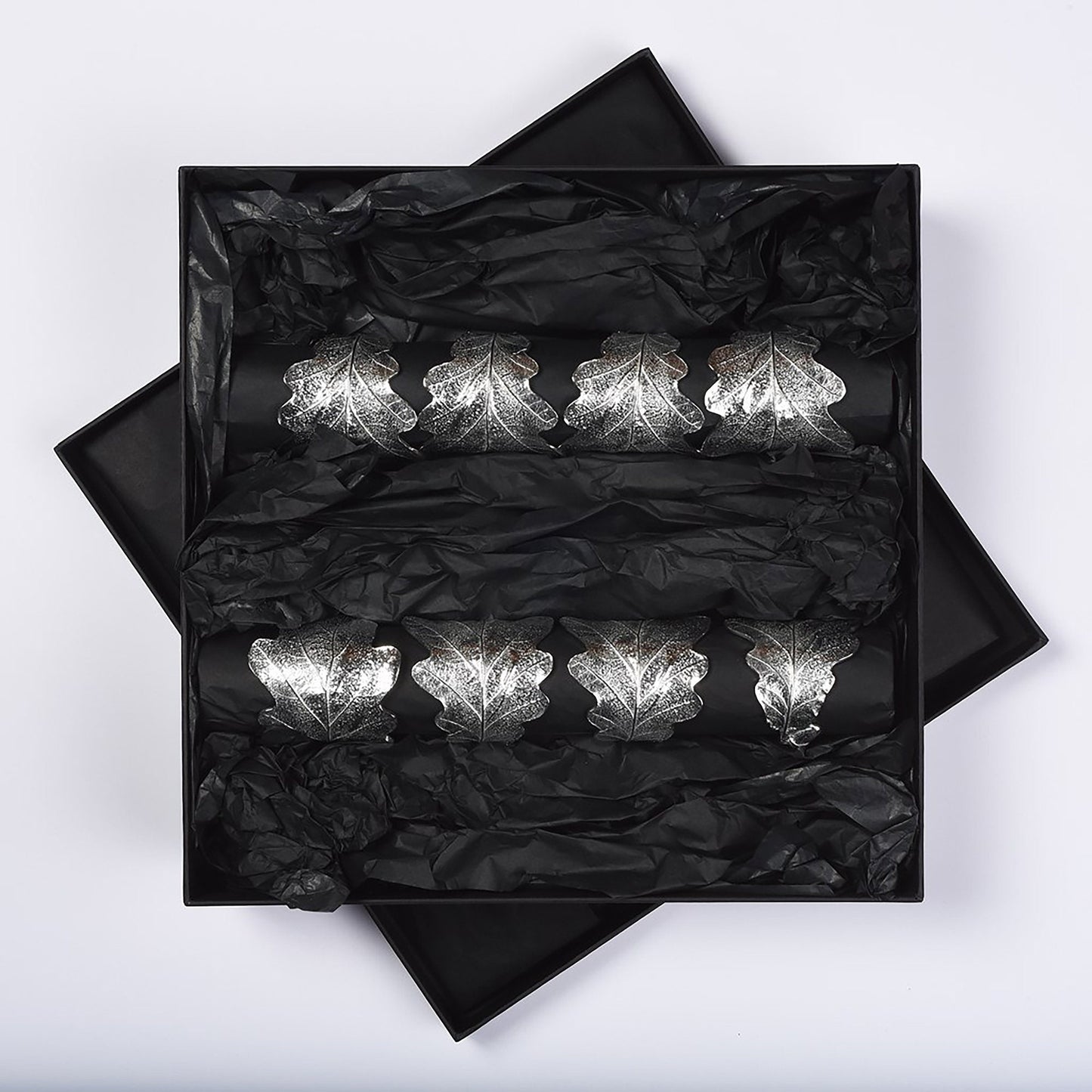 Oak leaf & acorn napkin rings set of 8. Detailed cast oak leaves with acorns curled into a practical & useful serviette rings. Small wedding gifts, gifts for nature lovers. Pewter tableware gifts for couples. Housewarming or wedding gifts UK made