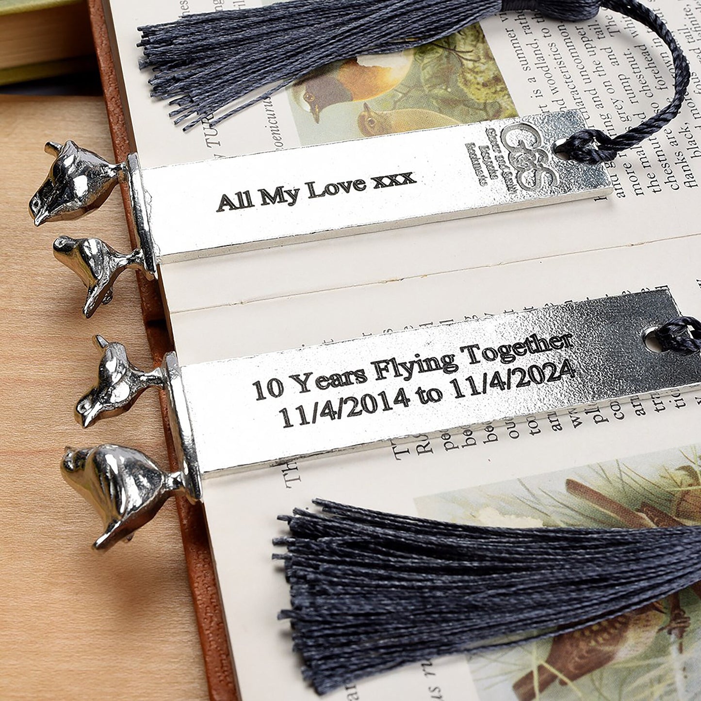 A personalised engraved pewter metal bookmark with a wren and a robin on the top. We can engrave the front and the back with your own personalised messages. Unique gifts. Ideal 10th tin wedding anniversary gift. Our pewter is 95% tin.