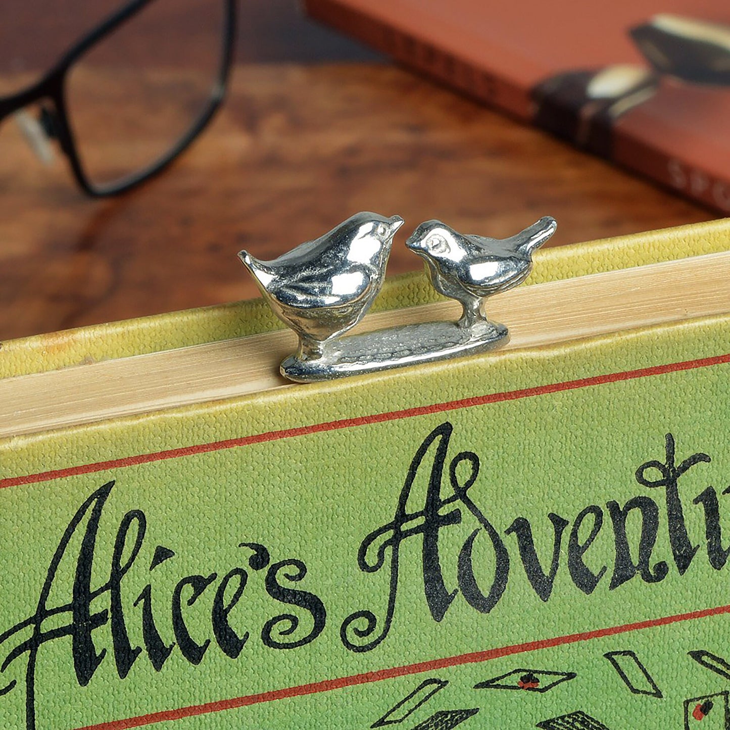 A personalised engraved pewter metal bookmark with a wren and a robin on the top. We can engrave the front and the back with your own personalised messages. Unique gifts. Ideal 10th tin wedding anniversary gift. Our pewter is 95% tin.