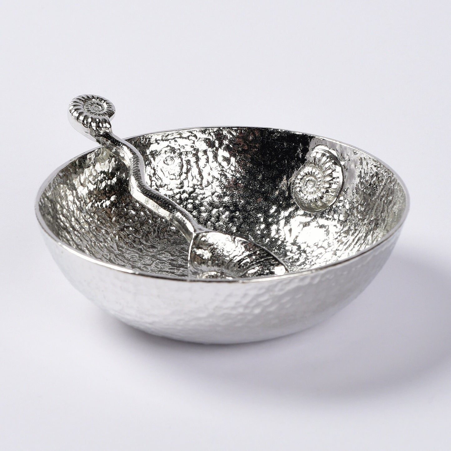 A 9cm diameter beautifully textured circular pewter bowl, with a striking, yet subtle ammonite fossil on the inside of the dish, comes with accompanying ammonite fossil spoon. Gifts For Fossil Lovers