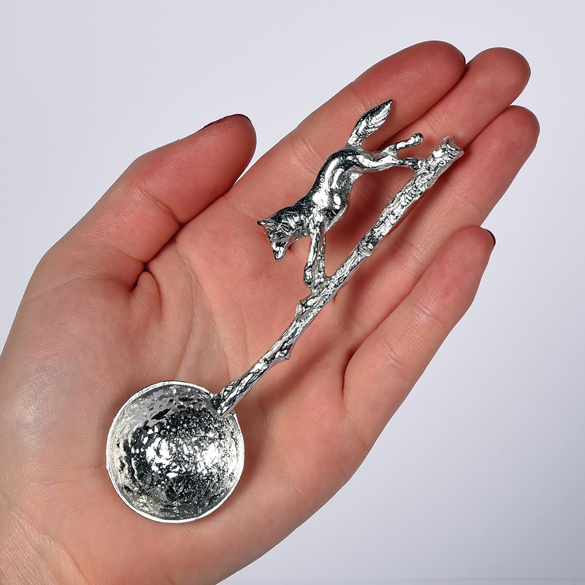 A small spoon pewter sugar spoon with a detailed fox running along a twig handle. Unusual, useful and tactile gifts for nature lovers, fox gifts handmade in the UK useful countryside gifts