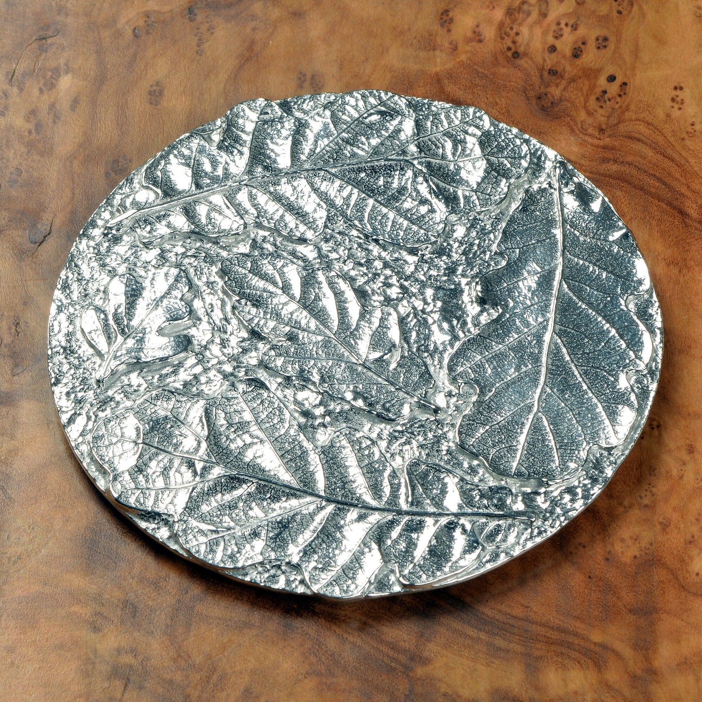 Oak leaf coaster, a circular composition of detailed cast oak leaves form an actractive round pewter drinks coaster. Practical and useful housewarming gifts, ideal gifts for nature lovers, UK handmade