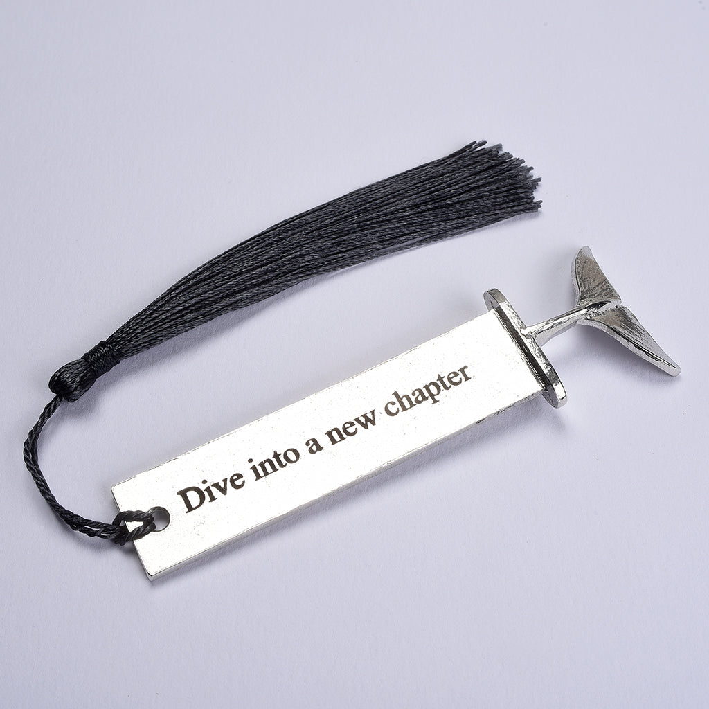 A personalised engraved pewter metal  bookmark with a diving dolphin tail on the top. On the front the quotation 'Dive into a new chapter'. New chapter gifts, dolphin gifts, personalised gifts, new job gifts. We engrave the back with your message