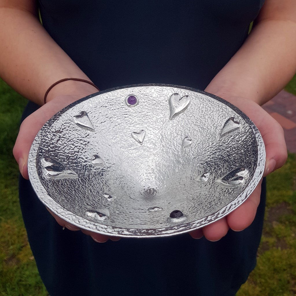  A large round pewter bowl encrusted on hearts, amethysts & garnets. The designated material for a tenth wedding Anniversary is tin. Our Lovers bowl makes the perfect 10th Tin 10 year wedding anniversary gift (our pewter is 95% tin). Edition of 250