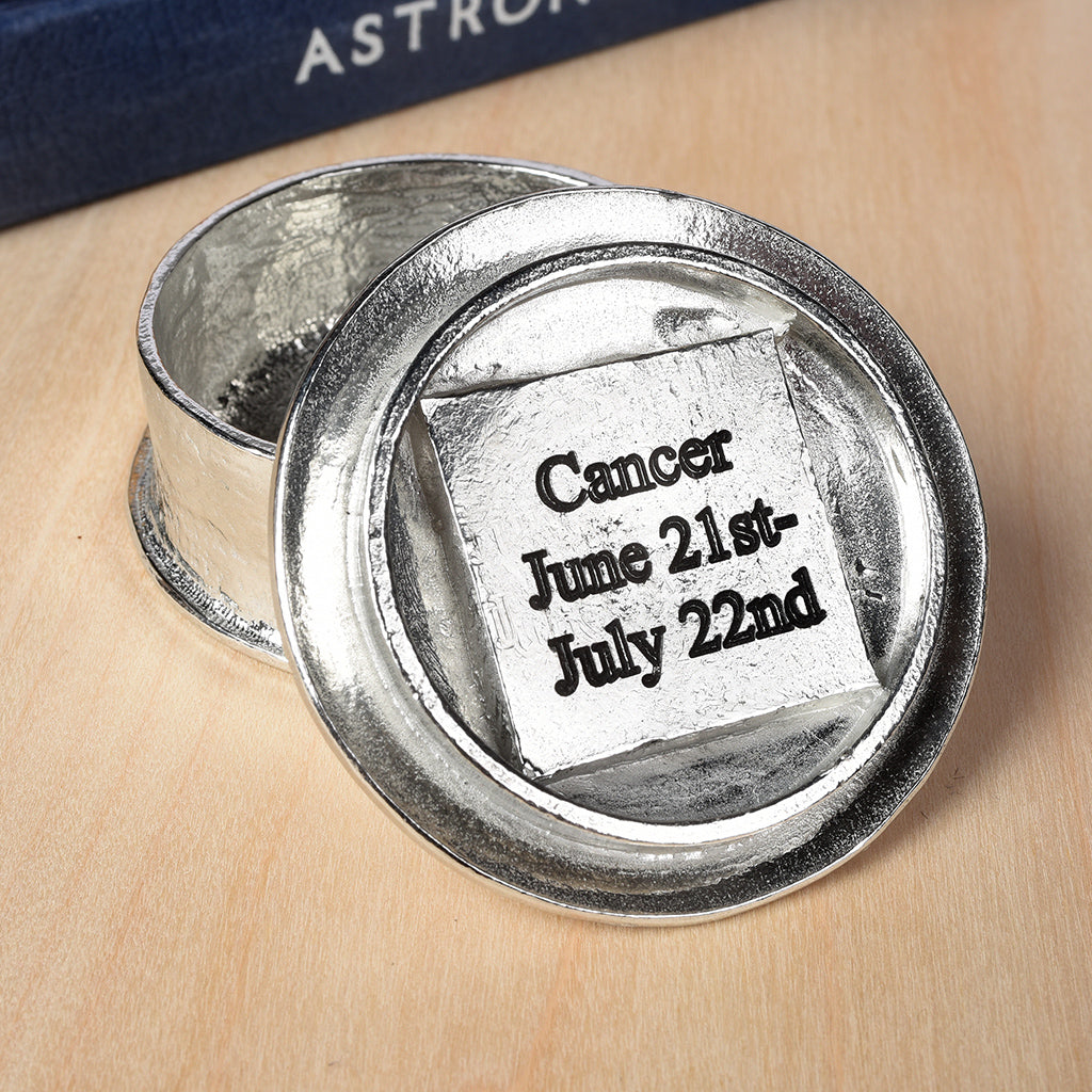 A beautifully detailed and textured Cancer crab zodiac sign guards precious treasure on this personalised pewter trinket box. Pensonalised birthday gifts for Cancer. The underside of the lid can be engraved with your personalised message.