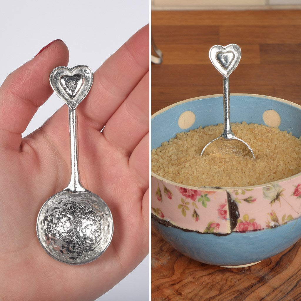 A small spoon pewter sugar spoon  with 2 love hearts on the end. Our love spoon makes an ideal little love token or 10th tin wedding anniversary gift or small wedding gift.