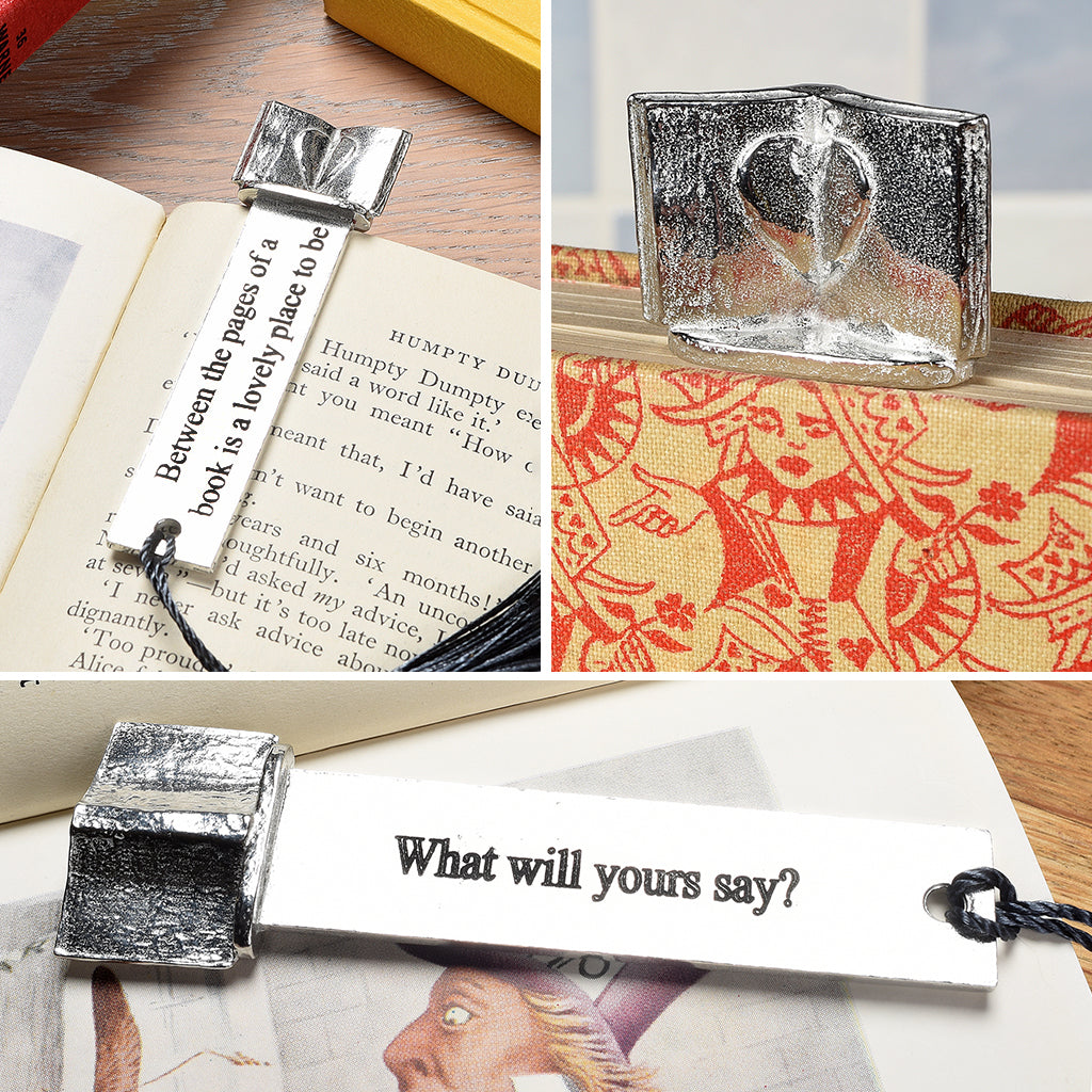 A personalized engraved pewter metal  bookmark with a heart on an open book on the top. On the front the quote 'Between the pages of a book is a lovely place to be'. Gifts for book lovers, book gifts, bookmarks for books