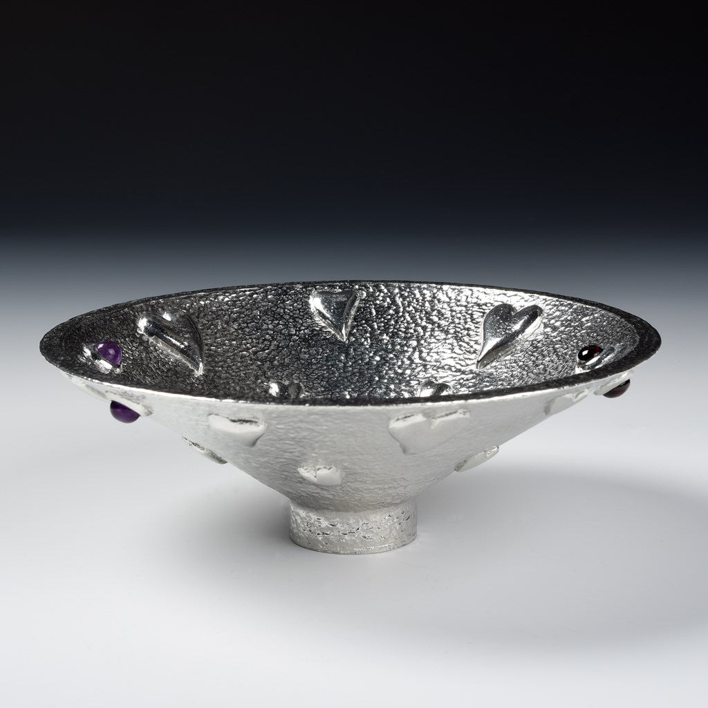  A large round pewter bowl encrusted on hearts, amethysts & garnets. The designated material for a tenth wedding Anniversary is tin. Our Lovers bowl makes the perfect 10th Tin 10 year wedding anniversary gift (our pewter is 95% tin). Edition of 250