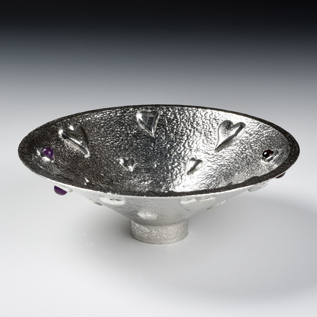  A large round pewter bowl encrusted on hearts, amethysts & garnets. The designated material for a tenth wedding Anniversary is tin. Our Lovers bowl makes the perfect 10th Tin 10 year wedding anniversary gift (our pewter is 95% tin). Edition of 250