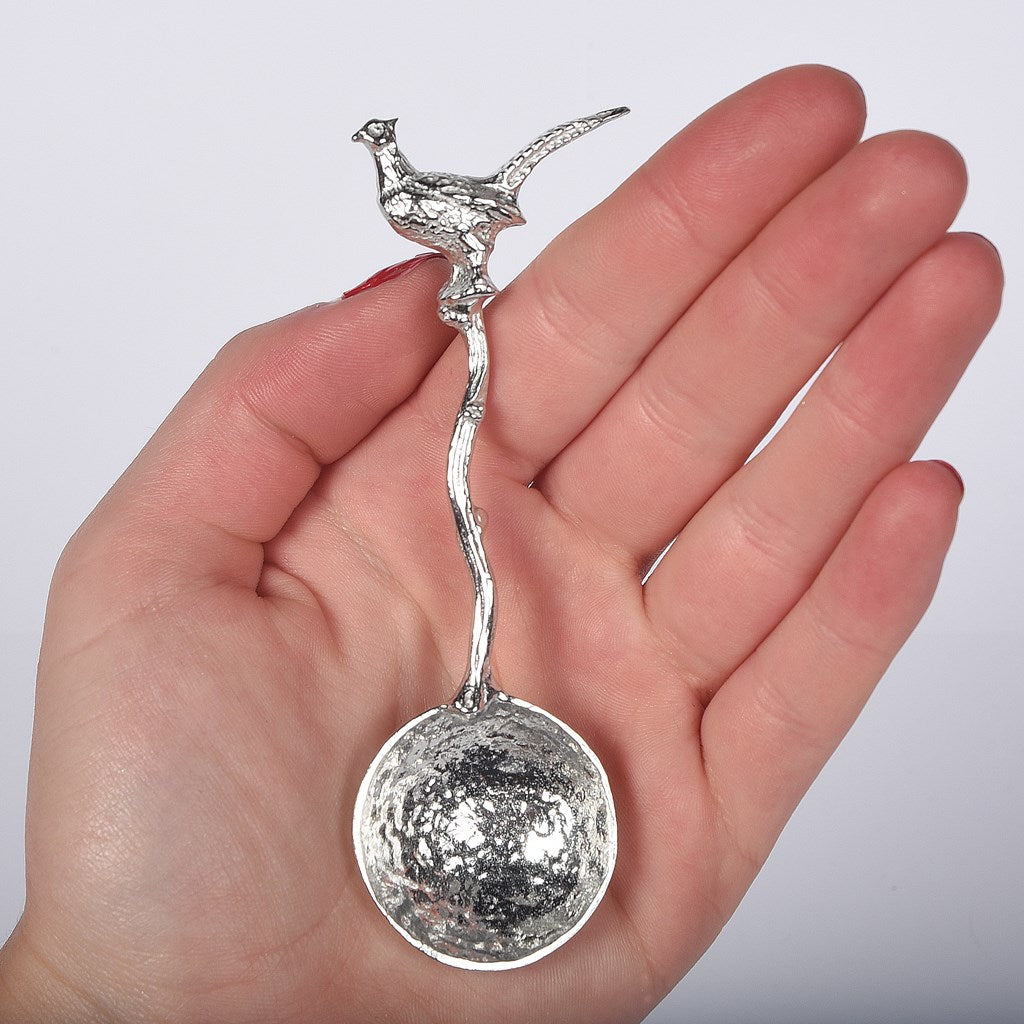 A small spoon pewter sugar spoon with a detailed pheasant on  a twig handle. Unusual, useful and tactile gifts for nature lovers, pheasant shooting gifts handmade in the UK useful countryside gifts