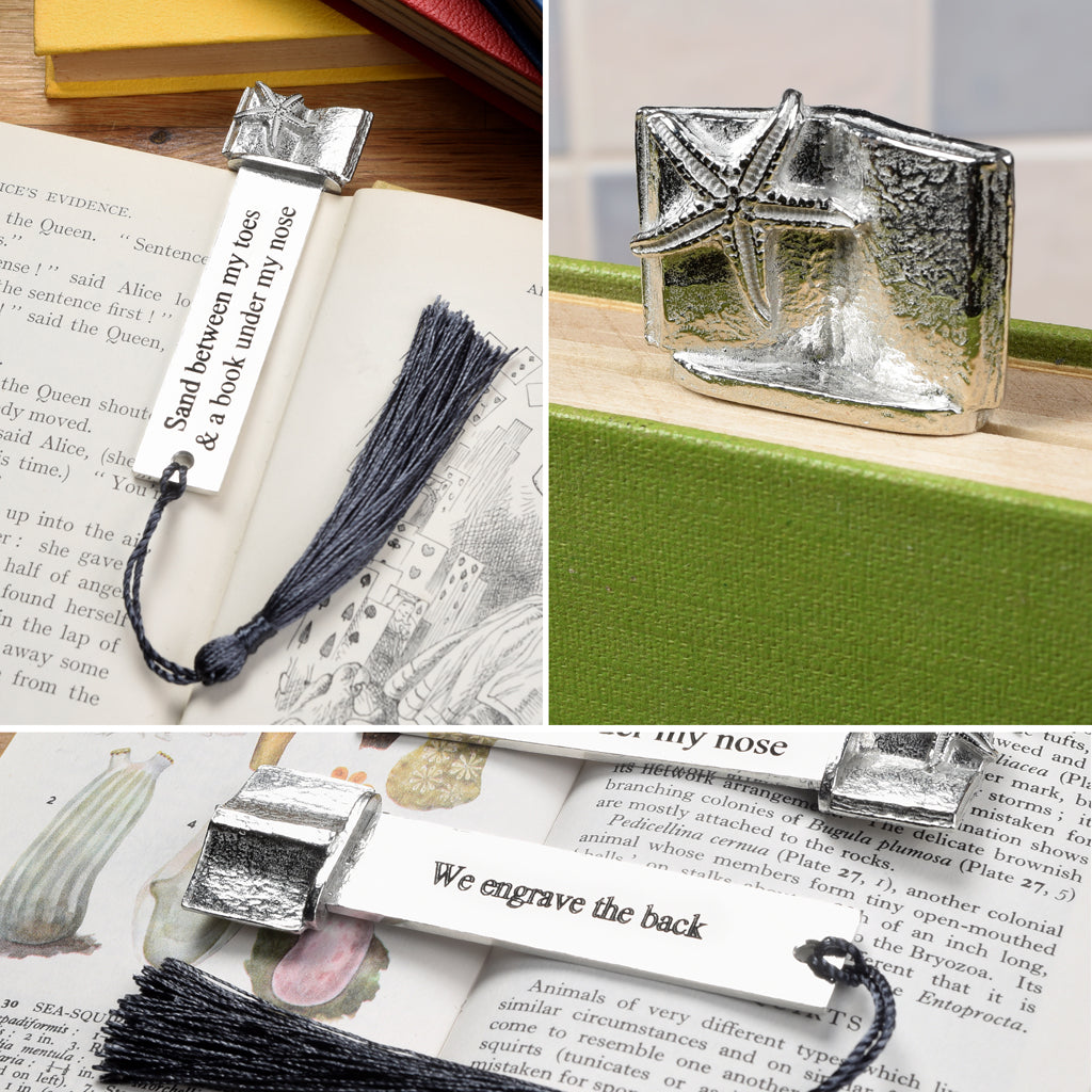 A personalized engraved pewter metal  bookmark with a starfish gripping an open book on the top. On the front the quote 'Sand between my toes & a book under my nose'. We engrave the back with your message. Holiday gifts, personalised gifts