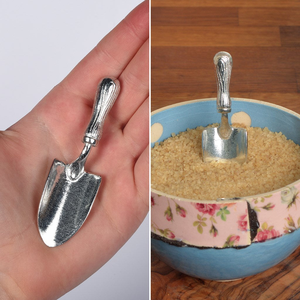 A small spoon pewter sugar spoon in the shape of a garden trowel . Unusual, useful and tactile gifts for gardeners and garden lovers handmade in the UK useful countryside gifts