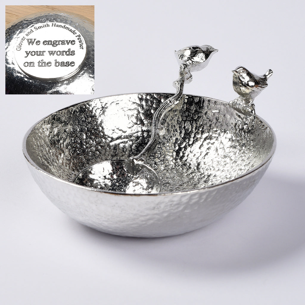 A 9cm diameter textured pewter bowl, with a wren bird perched on the edge of the dish, comes with matching wren spoon. Bird gifts. We engrave the base with your message. The ideal gift for any lover of birds, the natural world and the great outdoors.