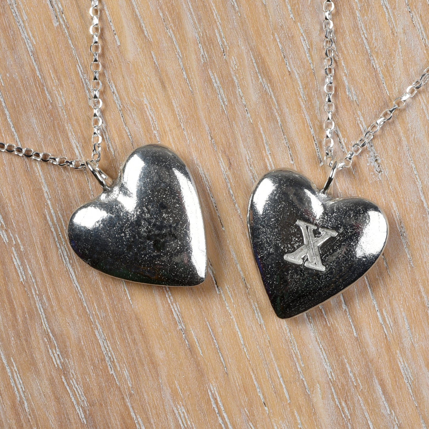 10th Anniversary gifts for her, tin gifts. A stylish and elegant pewter heart necklace with a X (signifying 10) engraved onto one side on an 18 inch Sterling silver chain.