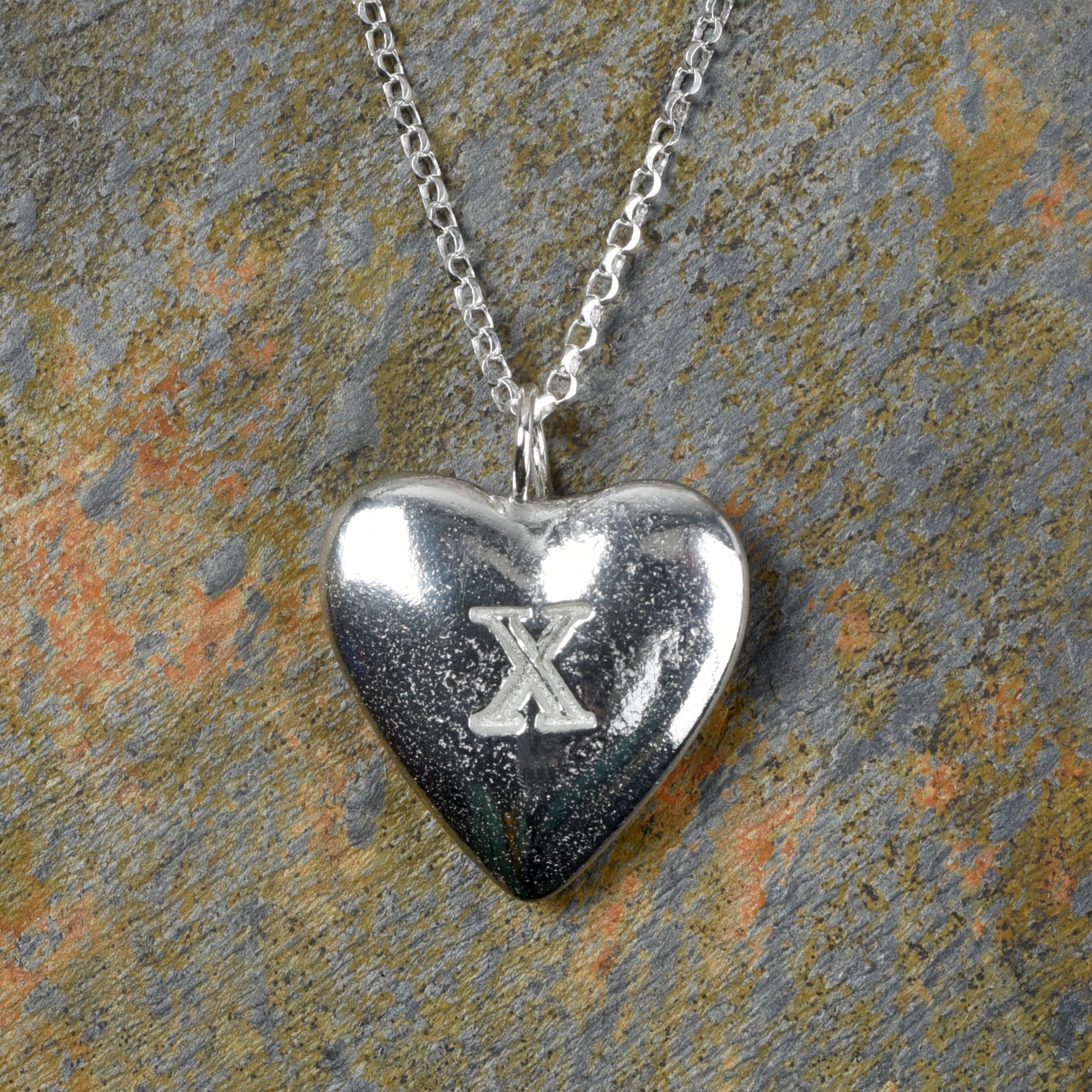 10th Anniversary gifts for her, tin gifts. A stylish and elegant pewter heart necklace with a X (signifying 10) engraved onto one side on an 18 inch Sterling silver chain.