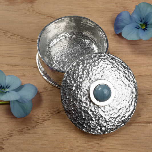 Aquamarine Birthstone Box with blue flowers on a wooden surface. March birthstone box gift. Pewter gifts handmade in the UK.