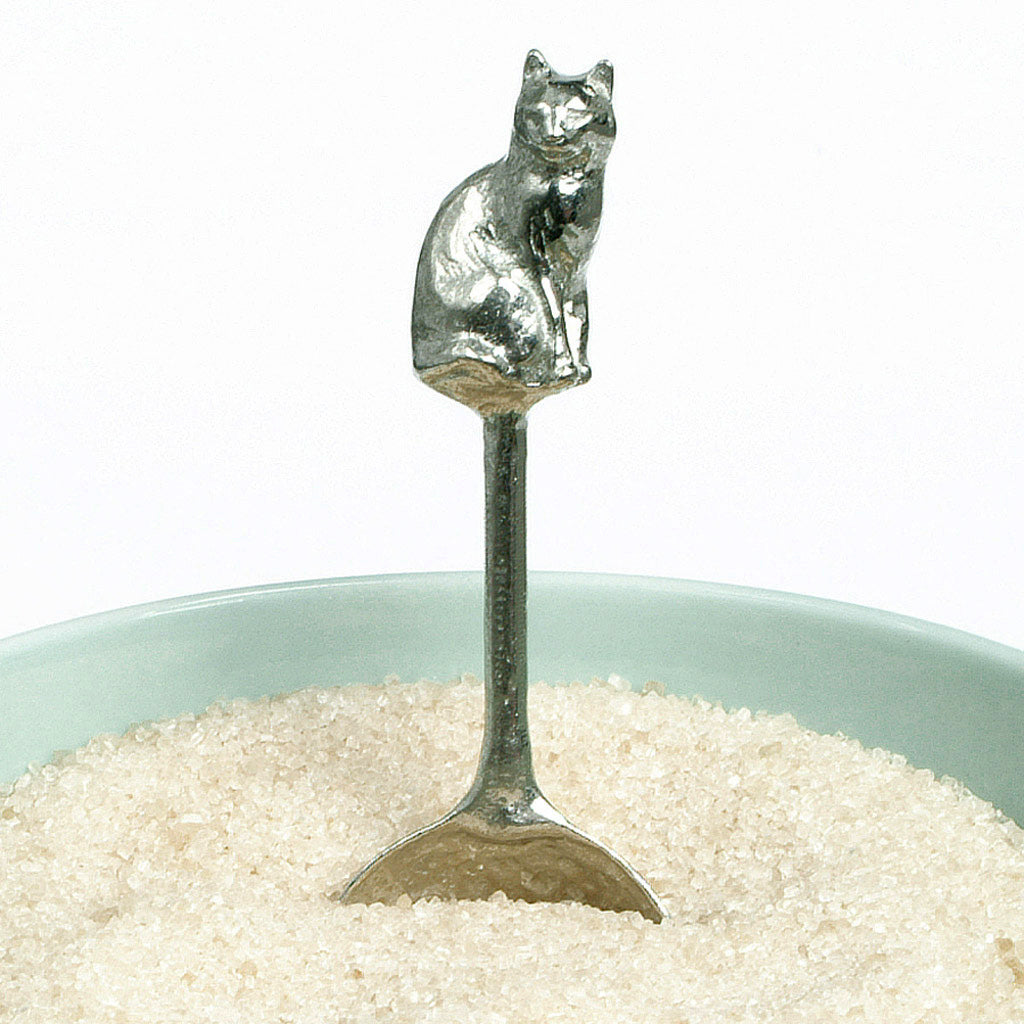 A small spoon pewter sugar spoon. A round bowled spoon on a straight handle leads to a perfectly sculpted cat. Practical & useful cat gifts for cat lovers. UK handmade