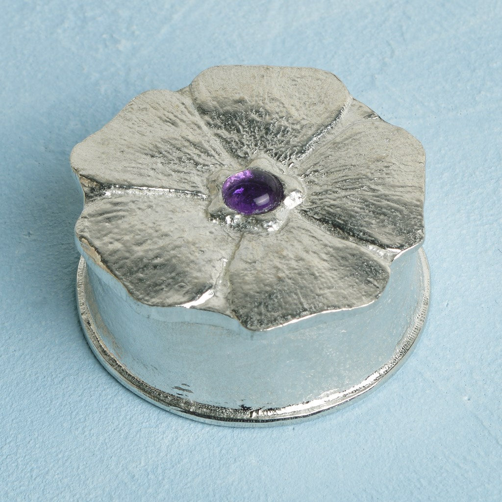 A forget me not flower pewter keepsake trinket box with an amethyst stone in the middle. A perfect 10th (Tin) ten year wedding anniversary gift (Our pewter is 95% tin). Great gifts for bridesmaids or a small wedding gift.