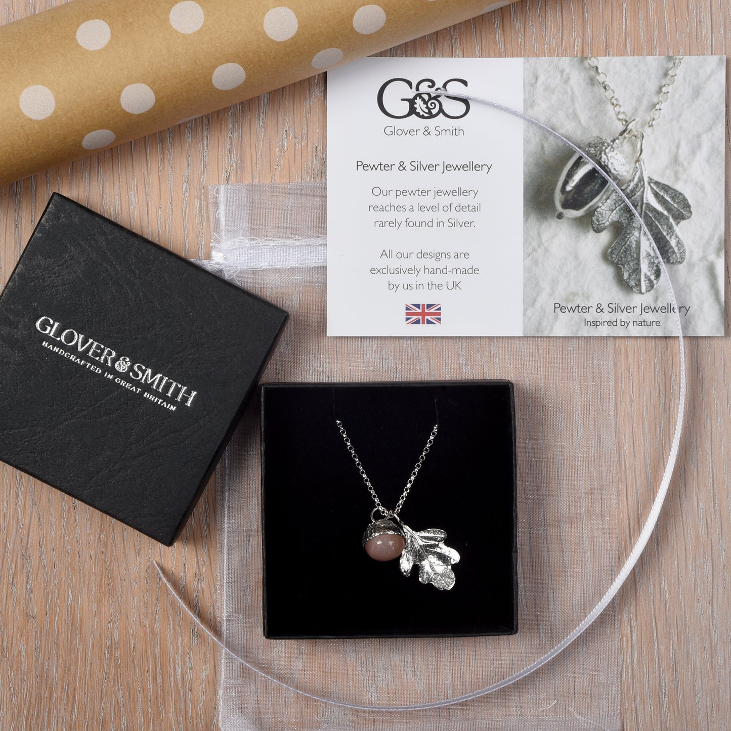 moonstone in a pewter acorn cup with an oak leaf on a Sterling silver necklace. Shown in packaging