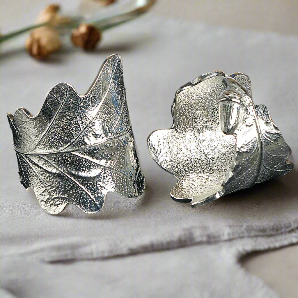 Oak leaf & acorn napkin rings pair. Detailed cast oak leaves with acorns curled into a practical & useful pair of serviette rings. Small wedding gifts, gifts for nature lovers. Pewter tableware gifts for couples. Housewarming or wedding gifts UK made