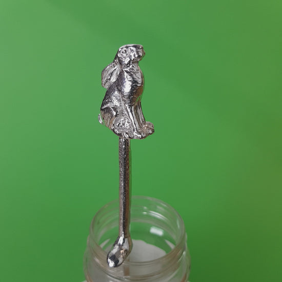 Long pewter jam spoon with a hook to hang on any jar. The top of the spoon has a hare sculpture on it.