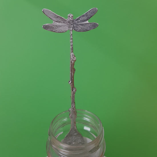 Long pewter jam spoon with a hook to hang on any jar. The top of the spoon has a dragonfly sculpture on it.
