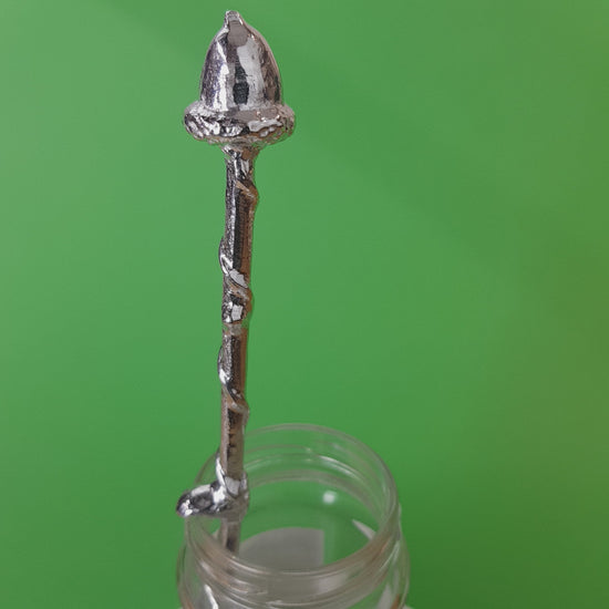Long pewter jam spoon with a hook to hang on any jar. The top of the spoon has an acorn sculpture on it.