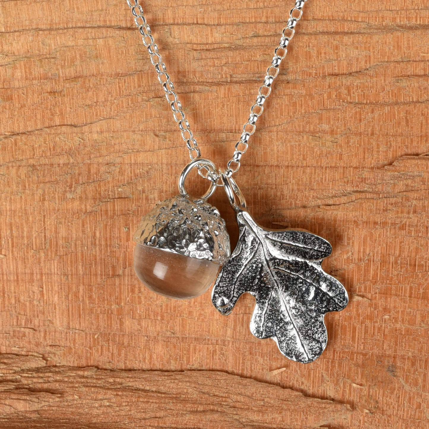 Pewter jewellery, an oak leaf necklace with an acorn cup with an rock crystal stone in it, April birthstone jewellery on a Sterling silver chain.