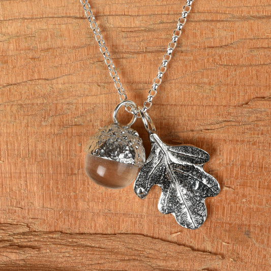 Pewter jewellery, an oak leaf necklace with an acorn cup with an rock crystal stone in it, April birthstone jewellery on a Sterling silver chain.