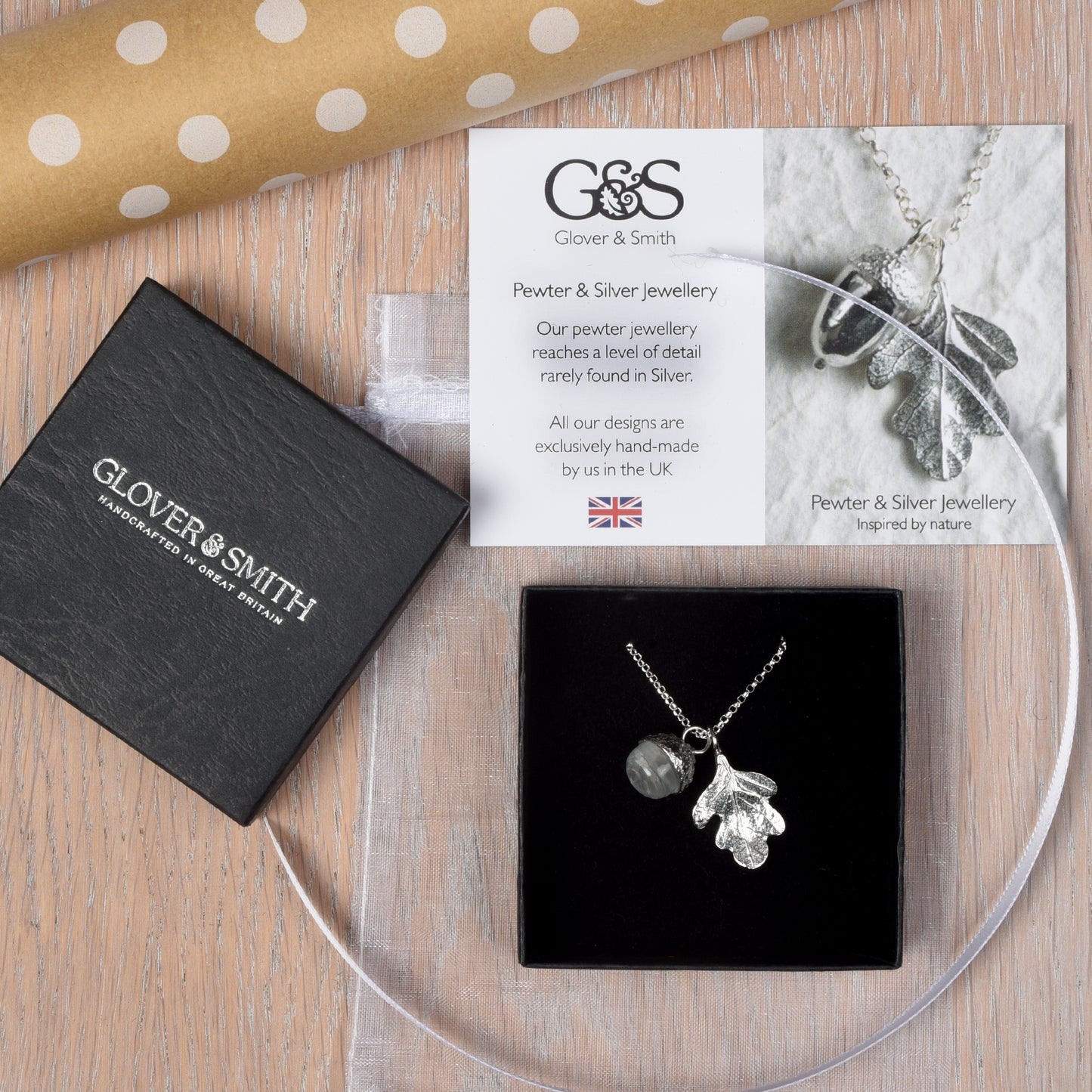 Pewter jewellery, an oak leaf necklace with an acorn cup with an rock crystal stone in it, April birthstone jewellery on a Sterling silver chain. Shown in its packaging.