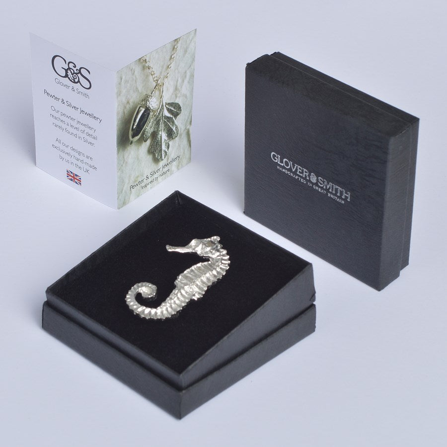 An eye catching and beautifully detailed seahorse pewter brooch. Great nautical seahorse gifts for lovers of the seaside and the ocean. Each seahorse brooch is 5.5cm (2.2 inches) tall and is attached with a metal clasp pin.