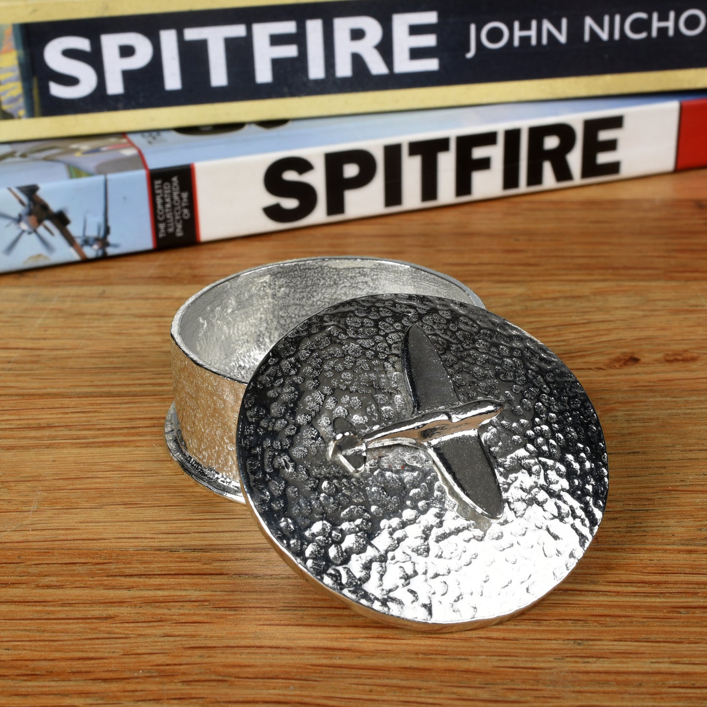 Spitfire gifts, a personalised, engraved 5 cm round pewter box with a Spitfire aeroplane sculpture on the lid. Gifts for Spitfire lovers.
