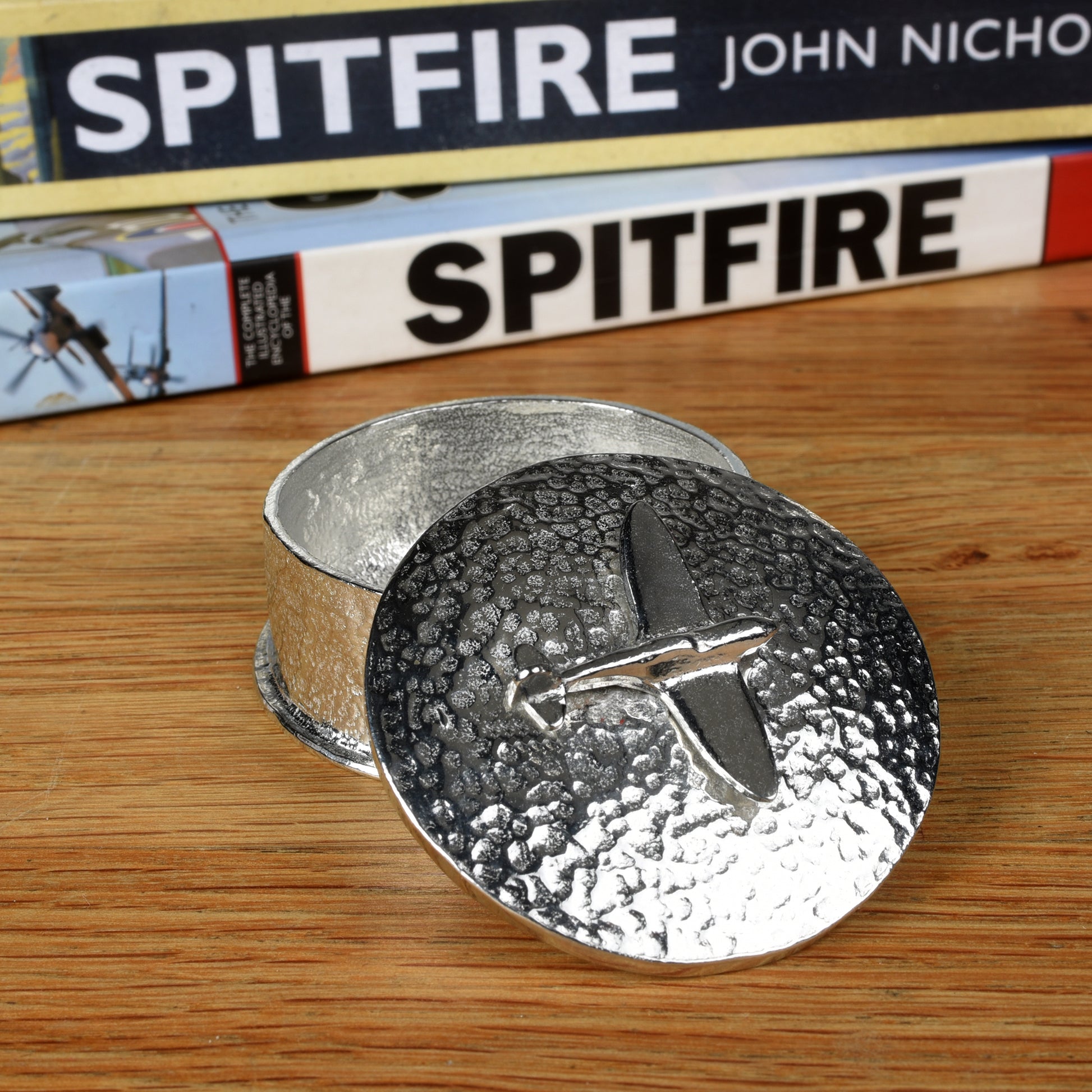 Spitfire gifts, a personalised, engraved 5 cm round pewter box with a Spitfire aeroplane sculpture on the lid. Gifts for Spitfire lovers.