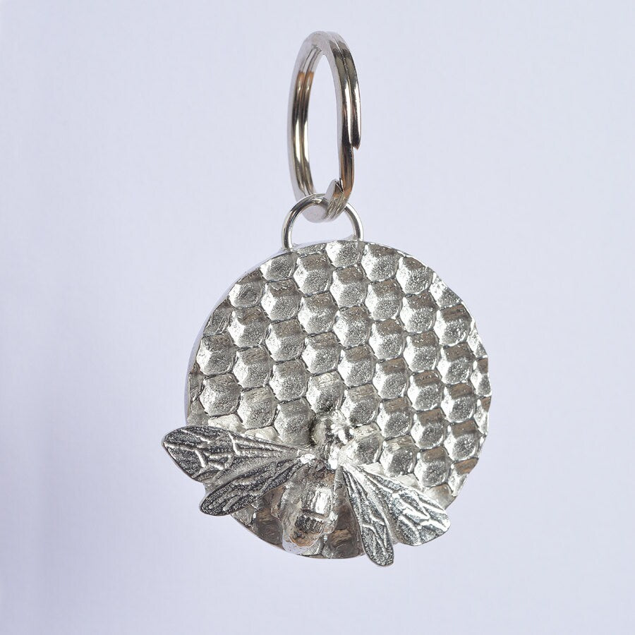 A solid pewter keyring, a bee sits on a honeycomb disc on a quality stainless steel ring. Gifts for bee lovers, bee gifts. Gifts for gardeners, gardeners gifts, useful gifts, housewarming gifts handmade in the UK