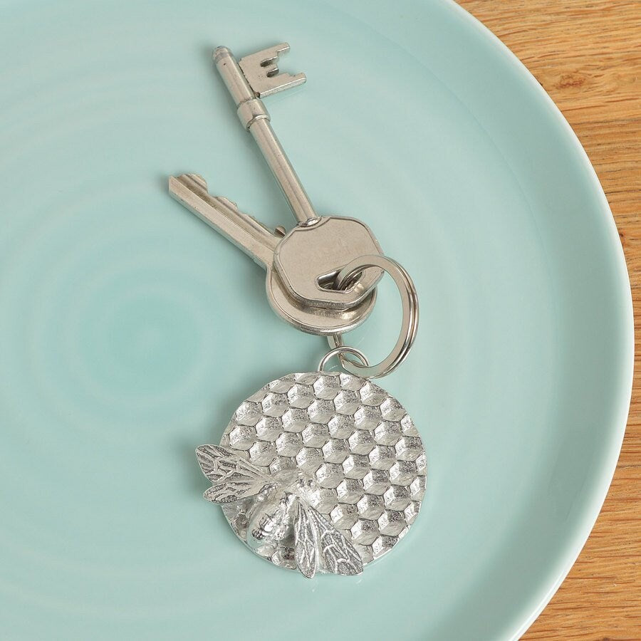 A solid pewter keyring, a bee sits on a honeycomb disc on a quality stainless steel ring. Gifts for bee lovers, bee gifts. Gifts for gardeners, gardeners gifts, useful gifts, housewarming gifts handmade in the UK