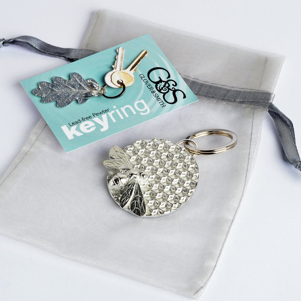 A solid pewter keyring, a bee sits on a honeycomb disc on a quality stainless steel ring. Gifts for bee lovers, bee gifts. Gifts for gardeners, gardeners gifts, useful gifts, housewarming gifts handmade in the UK