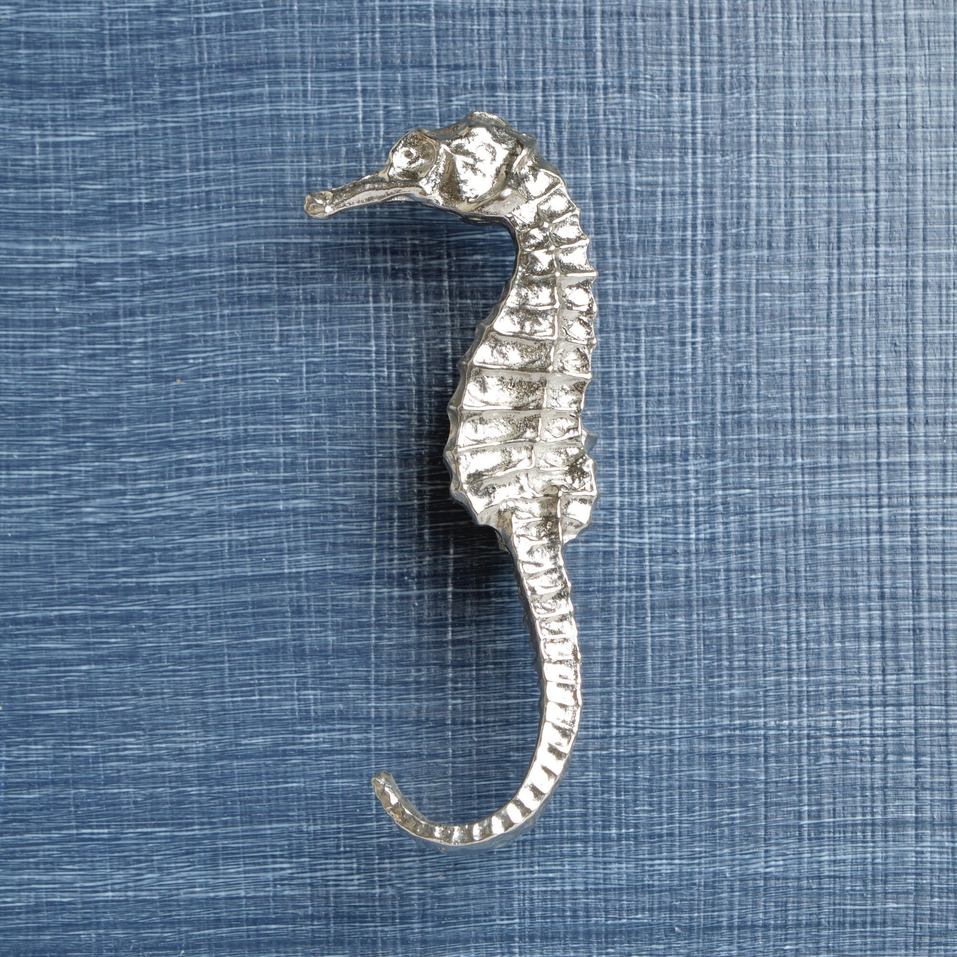 A solid pewter cabinet handle, cupboard knob, furniture handle or drawer pull in the shape of a detailed seahorse. Organic, unusual handles UK handmade with finesse