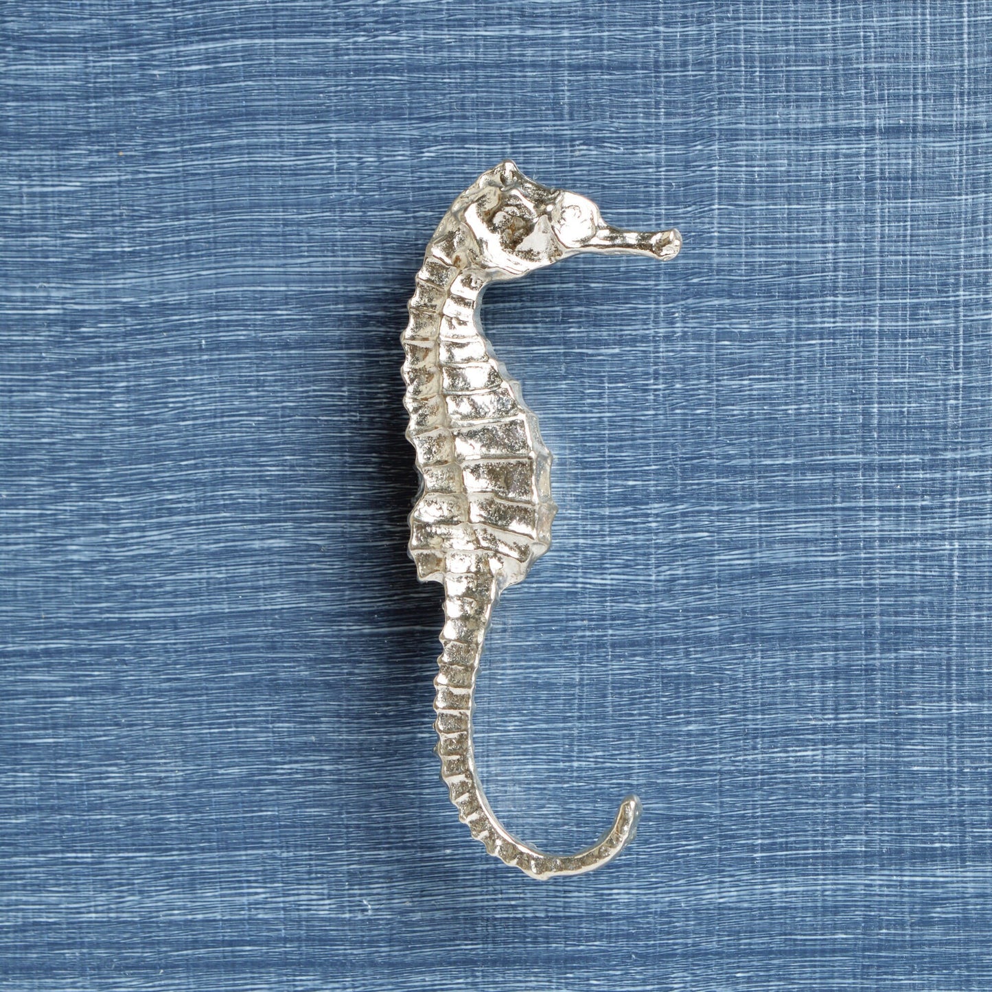 A solid pewter cabinet handle, cupboard knob, furniture handle or drawer pull in the shape of a detailed seahorse. Organic, unusual handles UK handmade with finesse