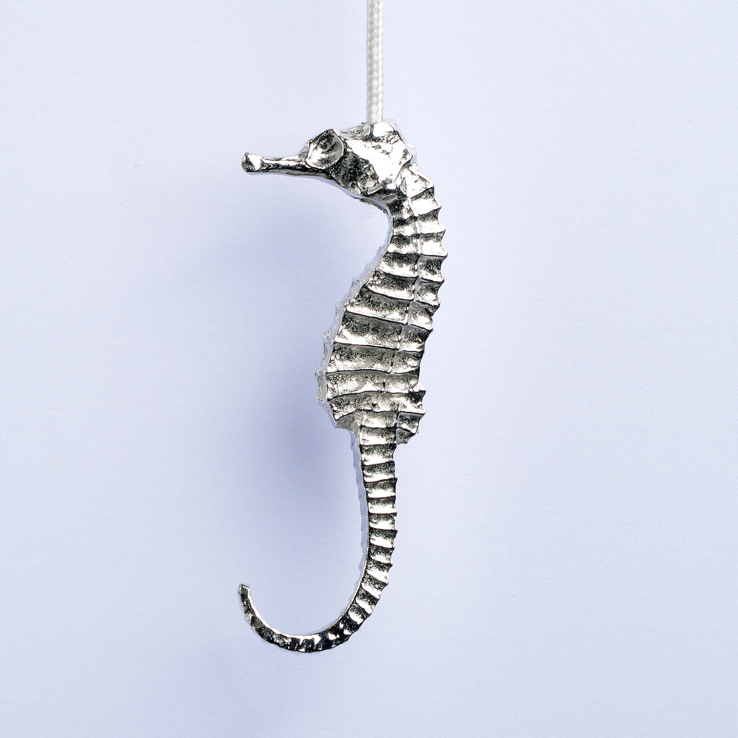 Seahorse bathroom light pull or cord pull. A tactile and decorative pewter seahorse hangs at the bottom of the bathroom light switch cord. ideal little housewarming gifts. Seahrse gifts for seahorse lovers.