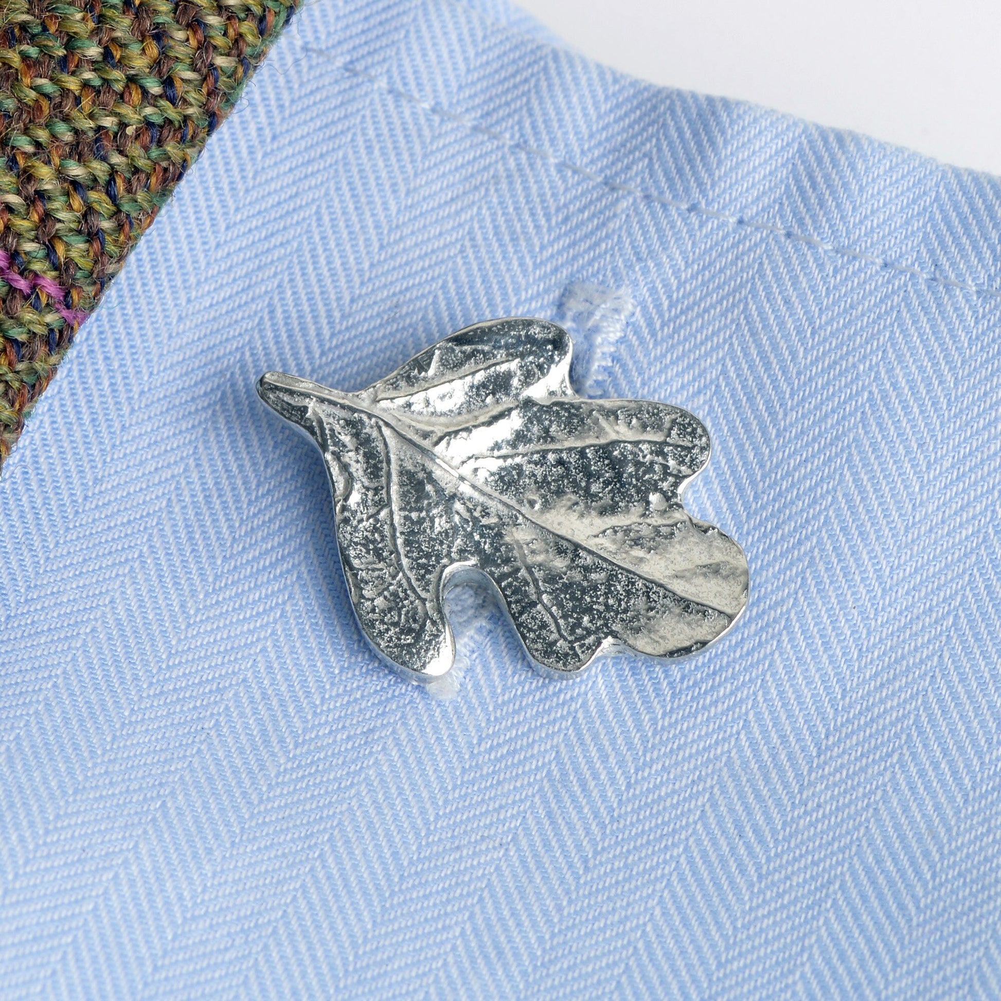 A pair of pewter acorns linked to  oak leaves via twig stems make a practical and beautiful cufflinks. 'Great oaks from little acorns grow'. Christening gifts for boys for use in later life. With certificate from giver.