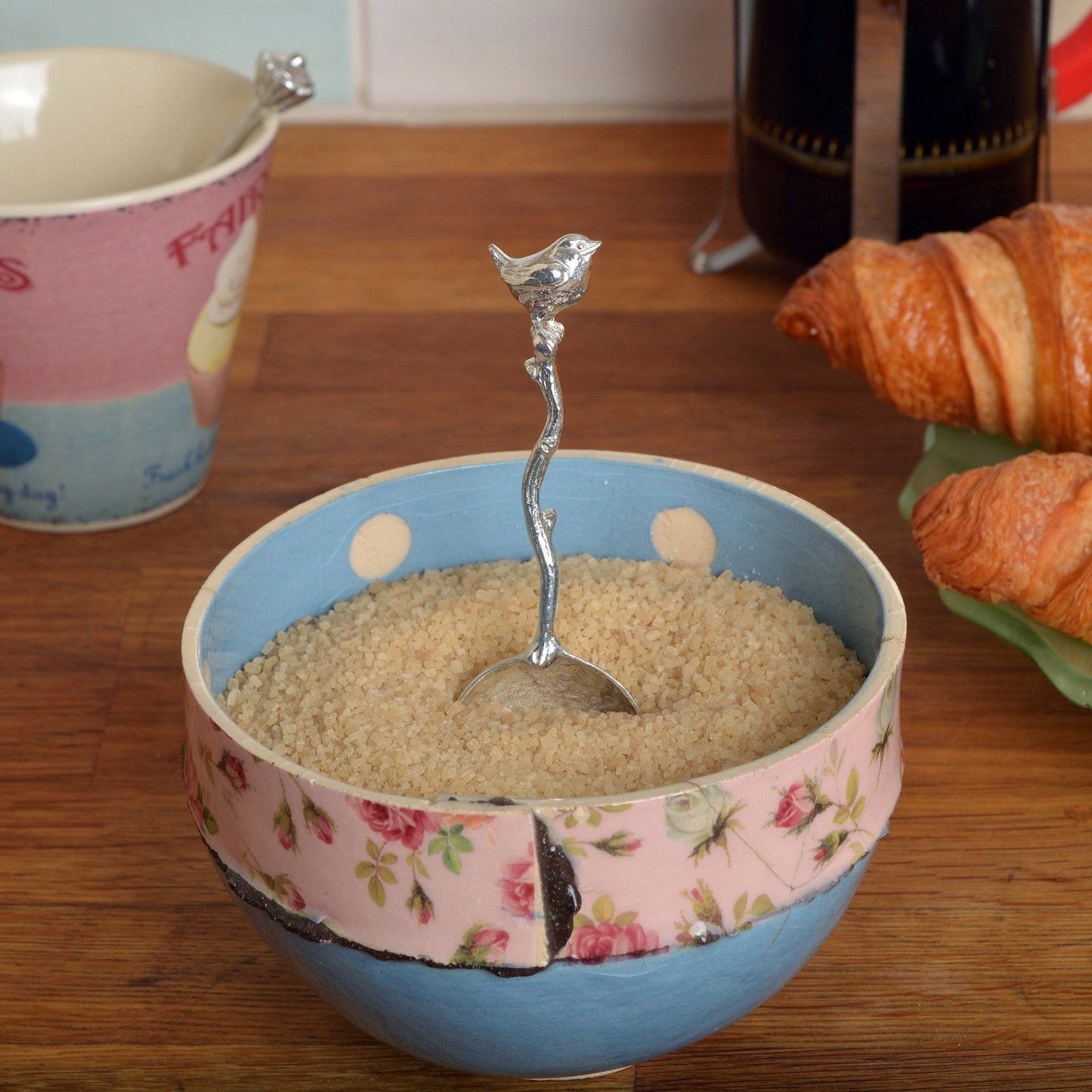 A small spoon pewter sugar spoon with a wren bird on the end of a twig handle. Unusual, useful and tactile gifts for bird lovers, Jenny wren gifts handmade in the UK