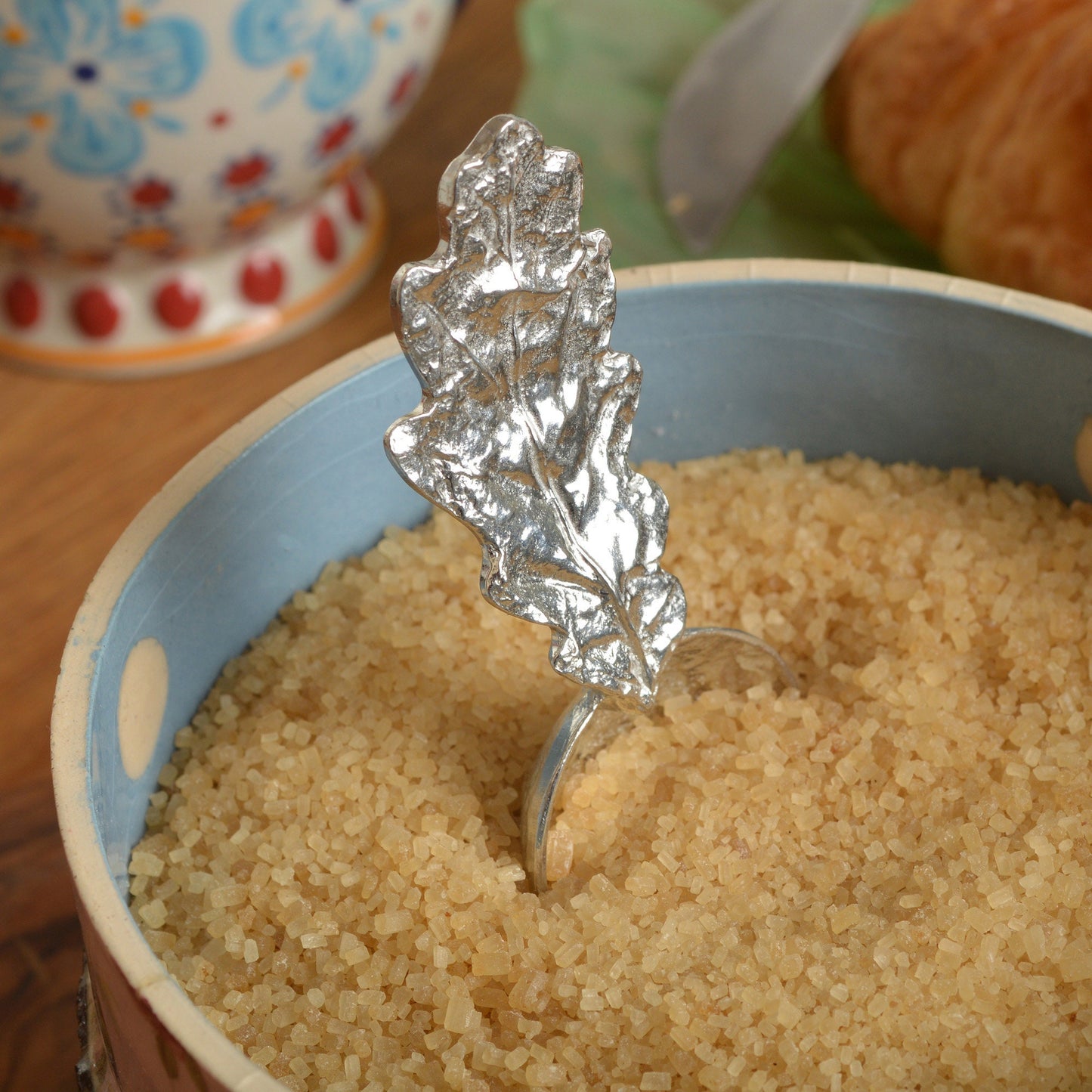 A small spoon pewter sugar spoon with an oak leaf handle. Ideal caddy spoon. Practical & useful oak leaf gifts for nature lovers little acorn gifts UK handmade